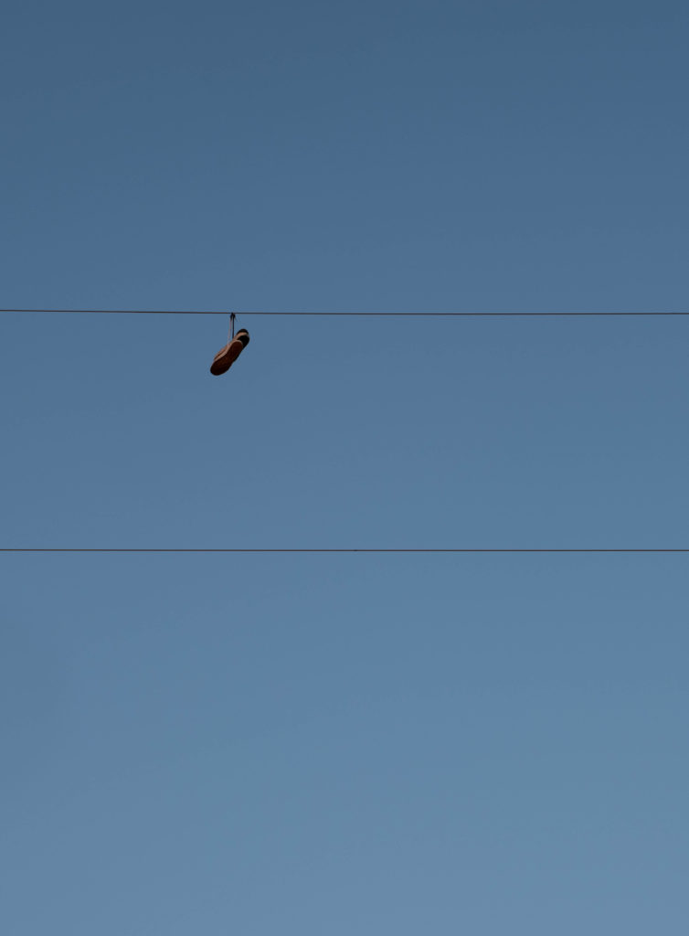 Shoes on a powerline outside Dilley Texas